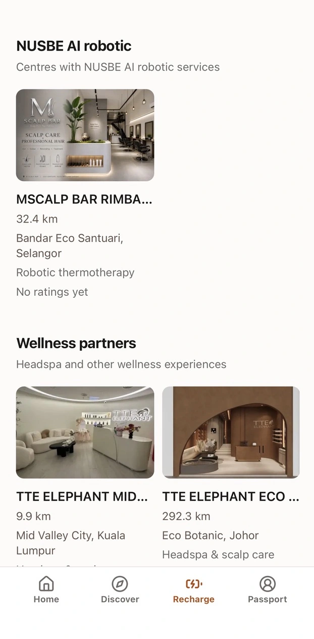 NUSBE marketplace app showing robotic service centres and wellness partners, including headspa and scalp care